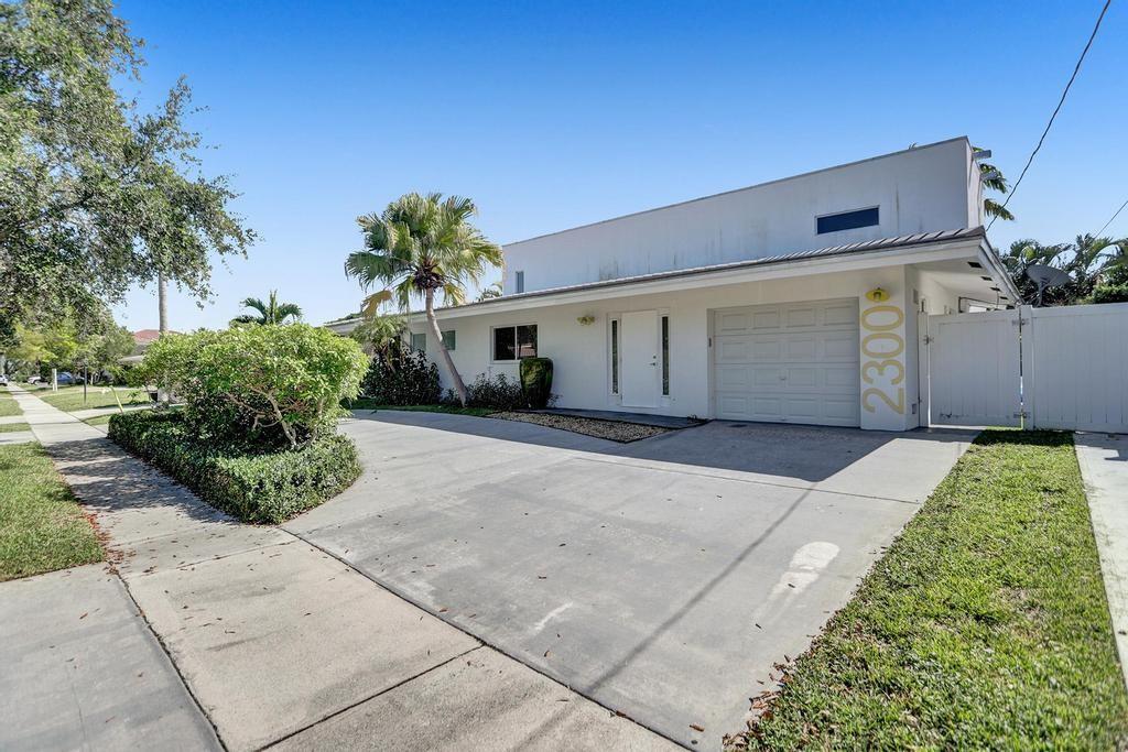 Expanded and re-imagined modern home in the heart of Lighthouse Point. Unique design, with one primary bedroom on each floor, along with three additional bedrooms. Four well-appointed baths allow for large families or groups to enjoy this home with space for everyone. Huge, covered lanai with serene pool and water views make this feel like a tropical resort. Full remodel and expansion were completed in 2014. Impact glass, along with CBS construction, make this a smart buy for primary or investment use. Available furnished. Make an appointment today!!
