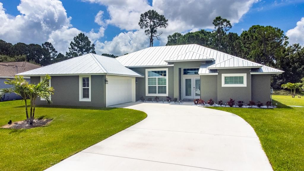 Photo of 4002 SW Mackemer Road SW, Port Saint Lucie, FL 34953 (MLS # R10748626)