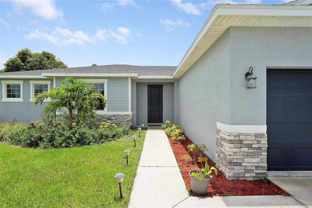 Photo of 2678 SW Cadet Circle, Port Saint Lucie, FL 34953 (MLS # F10511847)