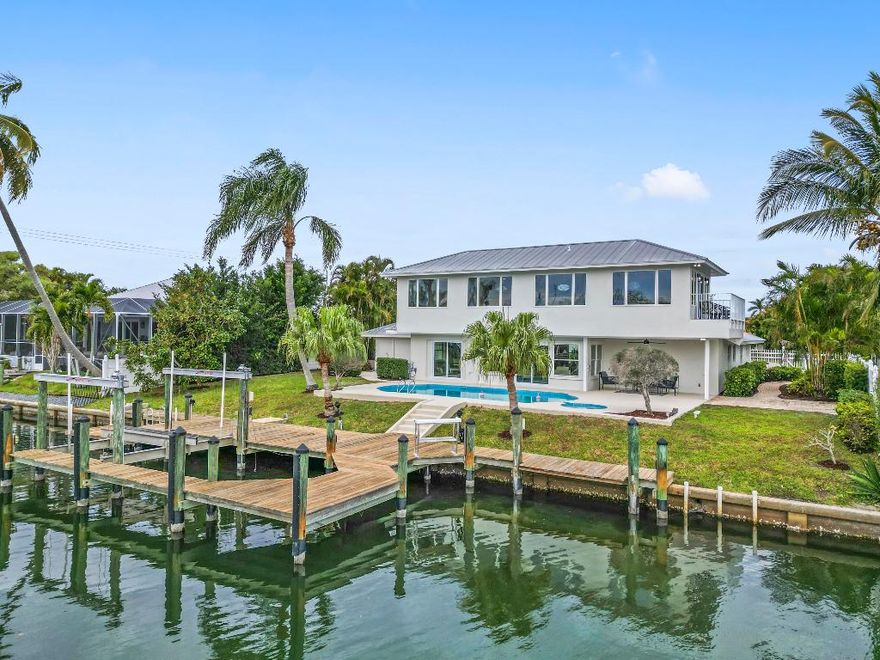 Welcome to 25 Park Avenue, a stunning waterfront home located on a deep water canal just an eighth of a mile from wide open intercoastal access. This beautifully renovated property offers open-concept living with all-new high-end finishes throughout. The spacious second-floor entertainment area includes a bar and breathtaking views of the water. Every detail has been carefully designed, including the complete renovation of the kitchen and all four bathrooms. Step outside to a private, expansive outdoor living space featuring a pool, spa, and an extra-large dock with two slips, davits, a lift, and an additional floating dock. Perfect for both relaxation and entertaining, this home offers ideal spaces for enjoying morning coffee or hosting sunset gatherings. Located in Vero Beach you'll experience the area's vibrant culture while enjoying the serenity of your own waterfront retreat. This home combines luxury, comfort, and the best of coastal living. Don't miss the opportunity to make this exceptional property your own!