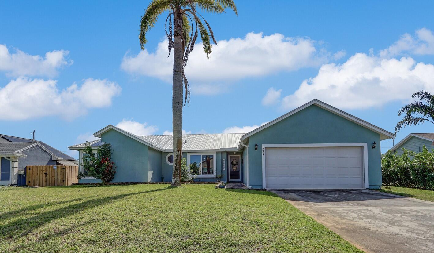 Welcome to this inviting 3-bedroom, 2-bathroom home with a 2-car garage, located in a community with no HOA. Inside, high ceilings and an abundance of natural light create a bright and airy atmosphere. The open kitchen is a delight, featuring white cabinets, beautiful tile backsplash, pantry, and a kitchen island with high top seating, perfect for casual dining or entertaining guests. Each bedroom is generously sized, with the large primary bedroom offering an en-suite bathroom with a walk-in shower, an updated vanity with granite countertops, and a spacious walk-in closet. Enjoy outdoor living with a covered patio, a screened pool, and jacuzzi, perfect for year-round enjoyment. The fenced backyard ensures privacy, making it an ideal space for both family gatherings and quiet moments.