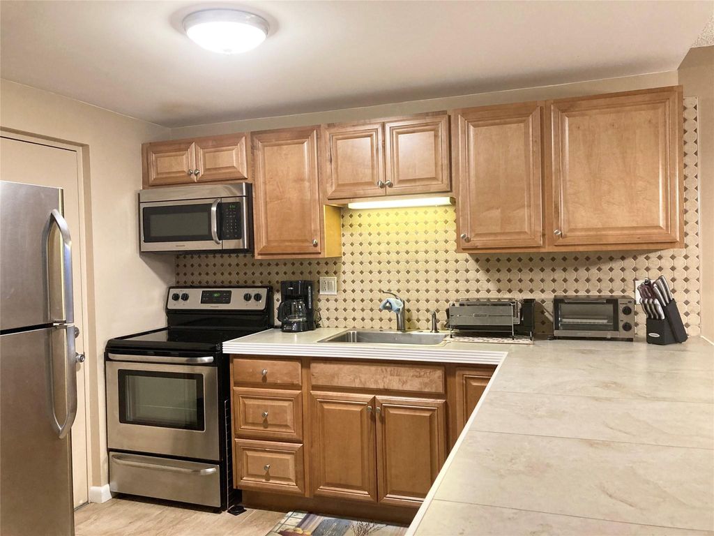Photo of 2316 S Cypress Bend Drive #317, Pompano Beach, FL 33069 (MLS # F10455595)
