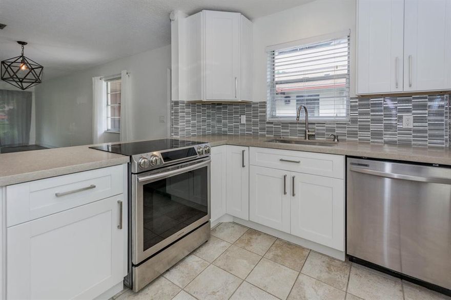 Light and bright renovated villa just minutes to Downtown Delray and the beaches in East Boynton Beach! Spacious open floor plan with modern updated kitchen complete with white shaker cabinets, stainless steel appliances, and granite counter tops. Open floor plan with laminate flooring throughout living areas, outfitted closets, newer water heater, and oversized patio overlooking the green belt for easy entertaining. Steps to the community pool! All ages and pet friendly. Don't miss this charming move in ready home!