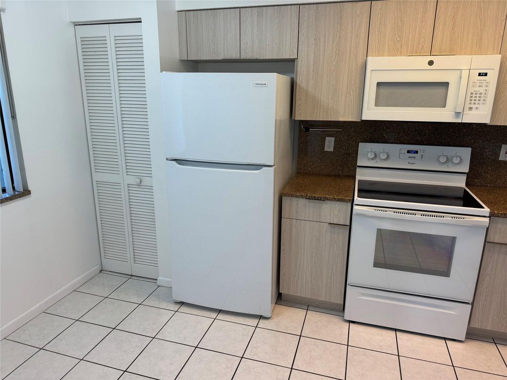 Photo of 2334 S Cypress Bend Drive #208, Pompano Beach, FL 33069 (MLS # F10518707)