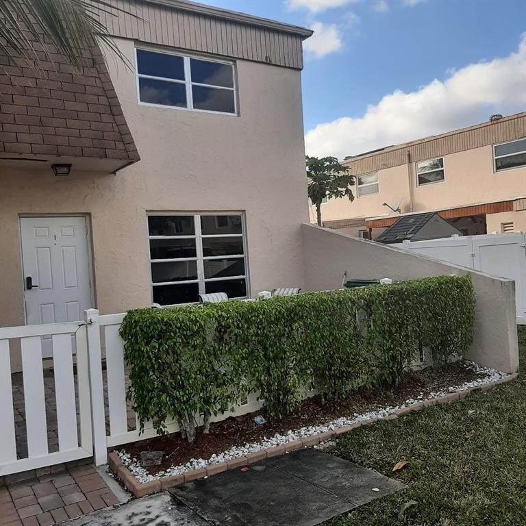 Fee simple townhome in Margate, Florida with brand new impact windows. Home features a downstairs bedroom for guest or office and fenced in patio. This is a short sale and requires lender's approval.