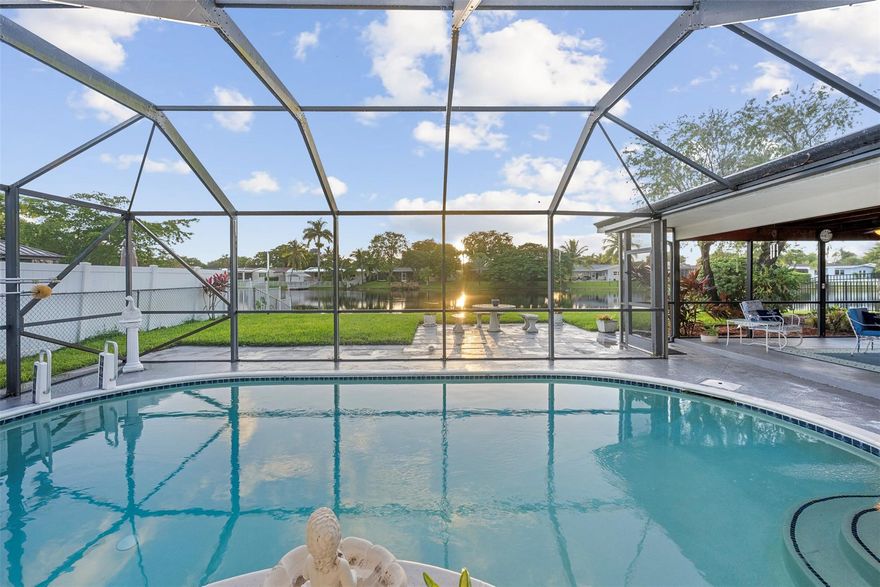 The care shows in every detail with just ONE proud owner on this oversized 11,000 sq ft lot. Make this your private oasis with the lush landscaping, sparkling pool, & lake views. The kitchen was remodeled in 2023. BONUS: gas stove! Impact windows, A/C, water heater, & tiled roof all updated in 2017, and the flat patio roof was redone in 2023 for added peace of mind. 2-car garage, freshly painted W/central A/C, flexibility for a workout area, workshop, etc. Other perks: upgraded electrical panel, renovated shed, cleaned underground plumbing, and PVC water pipes. Generous outdoor space, this home could easily be converted into 3 or 4 bedrooms, giving you room to grow. Near top-rated schools, this rare gem blends comfort, style, and versatility—come see the pride of ownership for yourself!