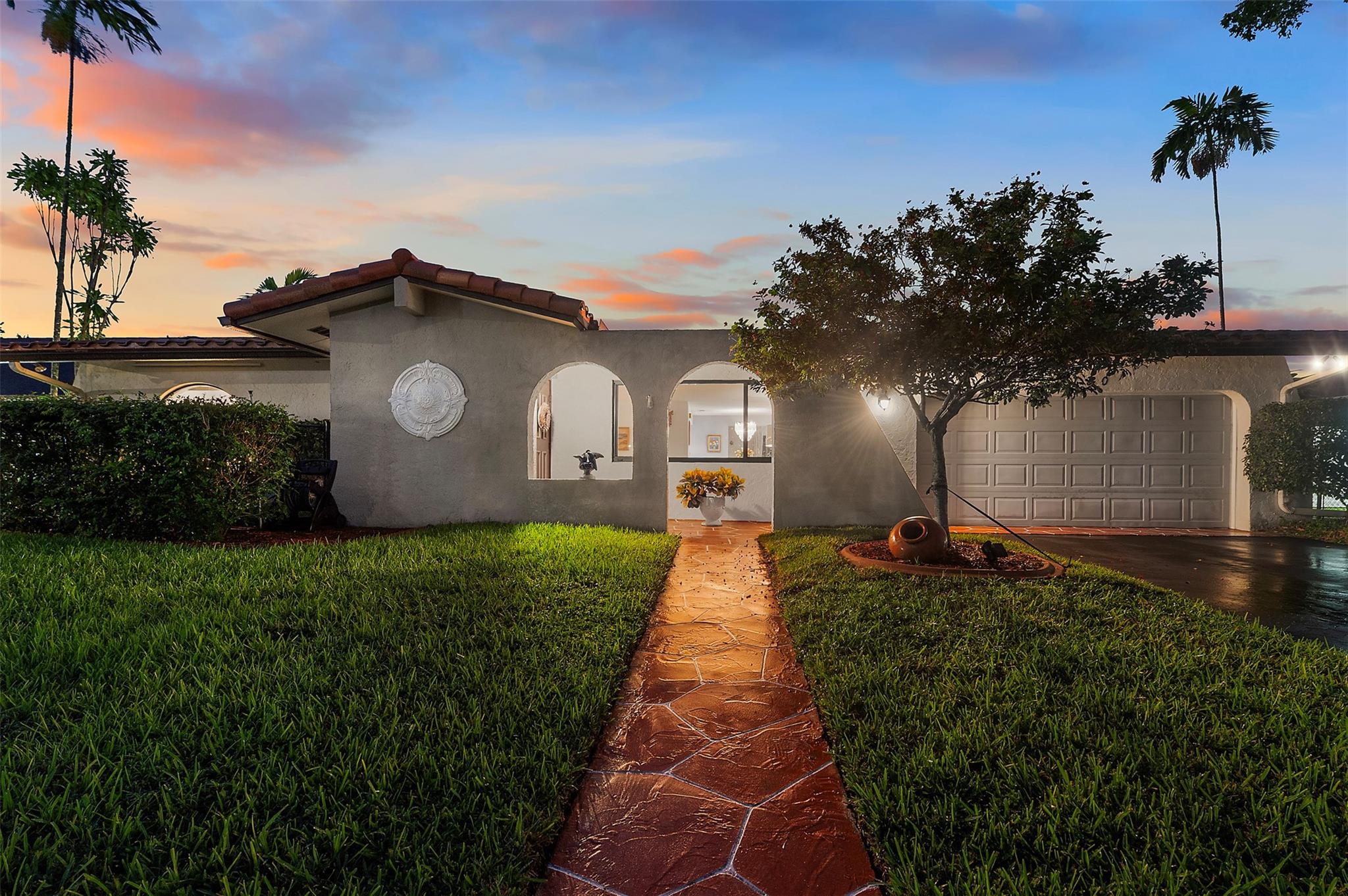 Live the Resort Lifestyle Every Day! Step into this stunningly updated home, set on an oversized 11,000 sq ft lot with lush landscaping, a sparkling pool, and peaceful lake views—your private oasis awaits! The stylish kitchen was remodeled 2023 with a gas stove. Impact windows, A/C, water heater, and tiled roof 2017, plus a flat patio roof redone in 2023, offer peace of mind. Spacious 2-car garage with fresh paint and central A/C is perfect for a workout area, workshop, or flex space. Extras include ample storage, upgraded electrical panel, newly renovated shed, cleaned underground plumbing, and PVC water pipes. Located near top-rated schools. With generous outdoor space, this property offers exciting potential for future expansion—truly a rare gem blending comfort, style, and versatility!