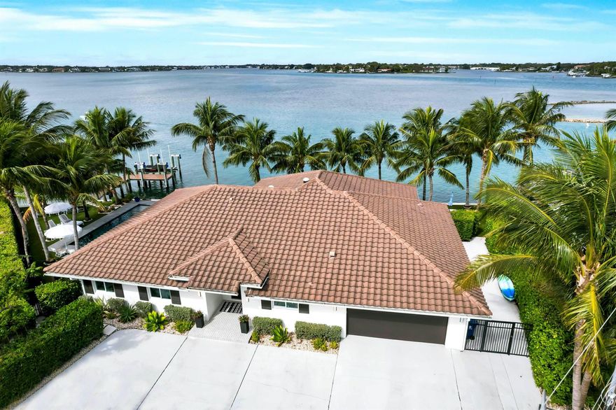 Commune with nature from your own backyard as you enjoy stunning, unobstructed sunset river views! Seize this opportunity to own a luxury home on a point lot, with expansive views of the Loxahatchee River. This remodeled 3/3 single-story cul-de-sac home in the heart of Jupiter offers 175' of private waterfront with a private dock and boat lift. A modern coastal-design features an open floor plan, high-end appliances and finishes, 8-foot kitchen island, heated pool, complete hurricane glass protection, mature coconut palms, shiplap detailing, water filtration system throughout the home, and so much more. Take the boat to some of Jupiter's most popular restaurants and bars! Minutes from the beach. This small community of Rio Vista offers private boat ramp access.