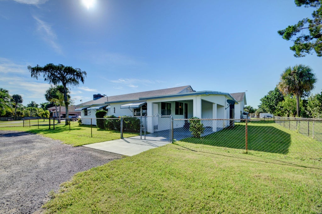 Photo of 6698 Belvedere Road, West Palm Beach, FL 33413 (MLS # R11095513)