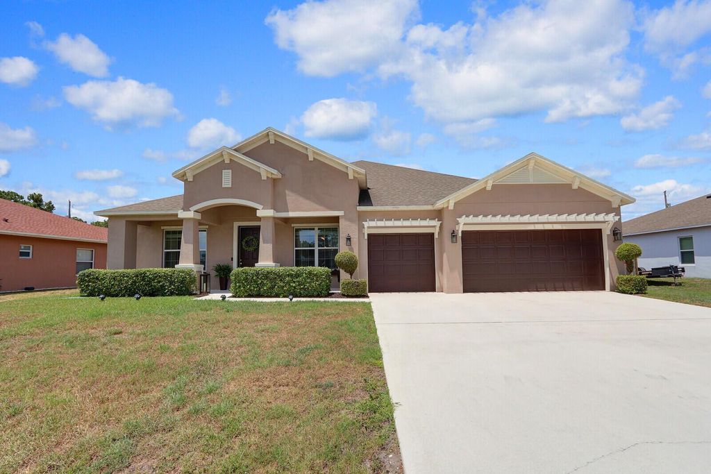 Photo of 4052 SW Mccandless Street, Port Saint Lucie, FL 34953 (MLS # R11089917)