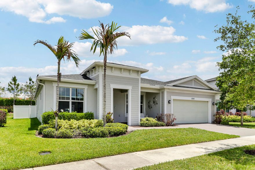 CHARMING, COASTAL POOL HOME IN THE GATED COMMUNITY OF MANDERLIE AT TRADITION! Perfectly located in one of Tradition's most popular communities and walking distance to all Tradition has to offer! This 3BR+Office/2BA/2CG home has a spacious open floor plan, large fenced yard with heated, salt water pool & spa, impact glass windows & doors, wood look tile through the main living areas and more. Built in 2021, this home has many special features including a great kitchen with white cabinetry, quartz counters, SS appliances, gas range, upgraded refrigerator, walk-in pantry, tiled backsplash and large center island with seating. The living area is open to the kitchen and dining space, creating the ideal floor plan for entertaining.  The master suite is a retreat of its own, overlooking the back yard and containing a spa-like ensuite with dual sinks & walk-in shower and a walk-in closet with built in closet organizers. Two additional bedroom share access to the hall bath. The spacious laundry room with utility sink helps keep those mountains of laundry at bay. Florida living is made easy in the oversized, fully fenced back yard with your very own private pool & spa (built in 2022). Enjoy lounging on the sun shelf in the pool, soaking in the hot tub or taking a swim - all in your own back yard! The covered patio space complete is ideal for lounging, dining and watching TV. Manderlie is a vibrant community located in the heart of Tradition where residents enjoy access to amenities including a resort style pool, fitness center, sports court, dog park and walking paths. Come enjoy all this home has to offer. Call today to view!