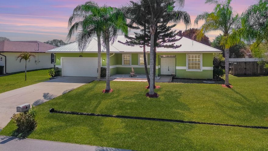 Welcome home! Check out this 3/2/2 CBS home with bright, open layout and diagonal tile throughout the main living areas. The massive chef's kitchen is a dream, boasting 42'' cabinetry, granite countertops, newer stainless steel appliances, and two pantries for maximum storage. Bonus: High-quality furniture is available for purchase, making this a truly turnkey opportunity! French doors lead to a roomy, screened, and covered lanai--perfect for relaxing while overlooking your large backyard with mature mango trees and a well-fed irrigation system. Peace of mind is guaranteed with a brand-new metal roof (2025) and full accordion hurricane shutters. This home is a must-see!