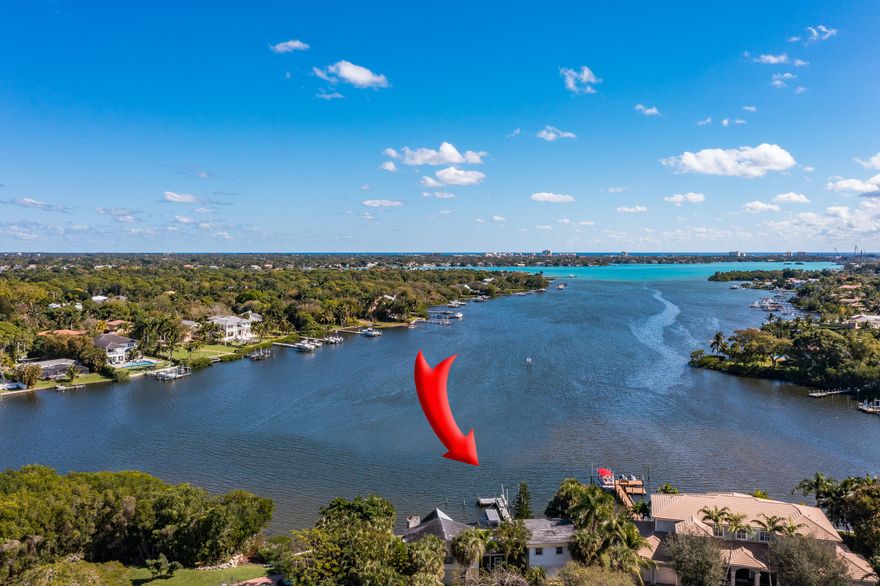 Breathtaking long views overlooking Loxahatchee River, 142 feet of waterfront, east exposure which will allow you to watch the sunrise. This is an opportunity of a lifetime to snatch up a rare find. Owner built this home 40 years ago and picked one of the best lots on the River. The main house has 2 Bedrooms with the primary bedroom being upstairs. Walk across the upstairs deck and enter the separate guesthouse with its own bath and kitchen. The guesthouse is currently rented and also has a private entrance. However the new owners may chose to build a new home on this gorgeous piece of paradise. There is a 50 foot dock for your boat leading out to the 10,000 lbs lift. Located in unincorporated Jupiter on a dead end street. 5 min to shopping, Restaurants, Hospital, Schools, I95 and Turnpike
