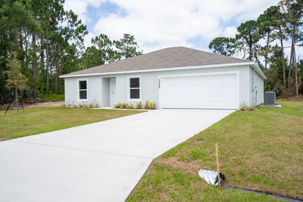 Photo of 2450 SE Renick Avenue, Port Saint Lucie, FL 34952 (MLS # R10742939)