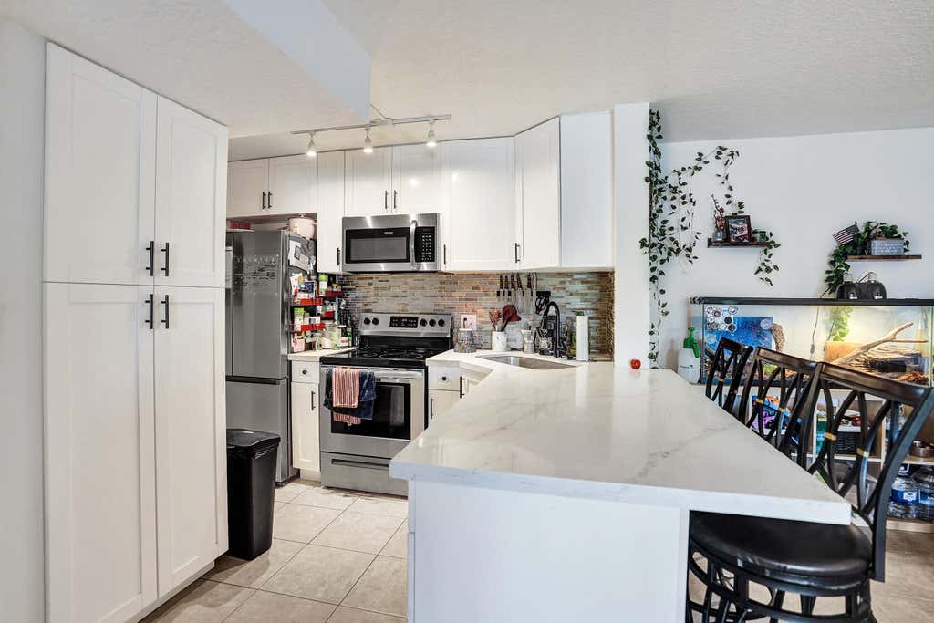 Photo of 629 Sea Pine Way #A1, Greenacres, FL 33415 (MLS # B26059113)