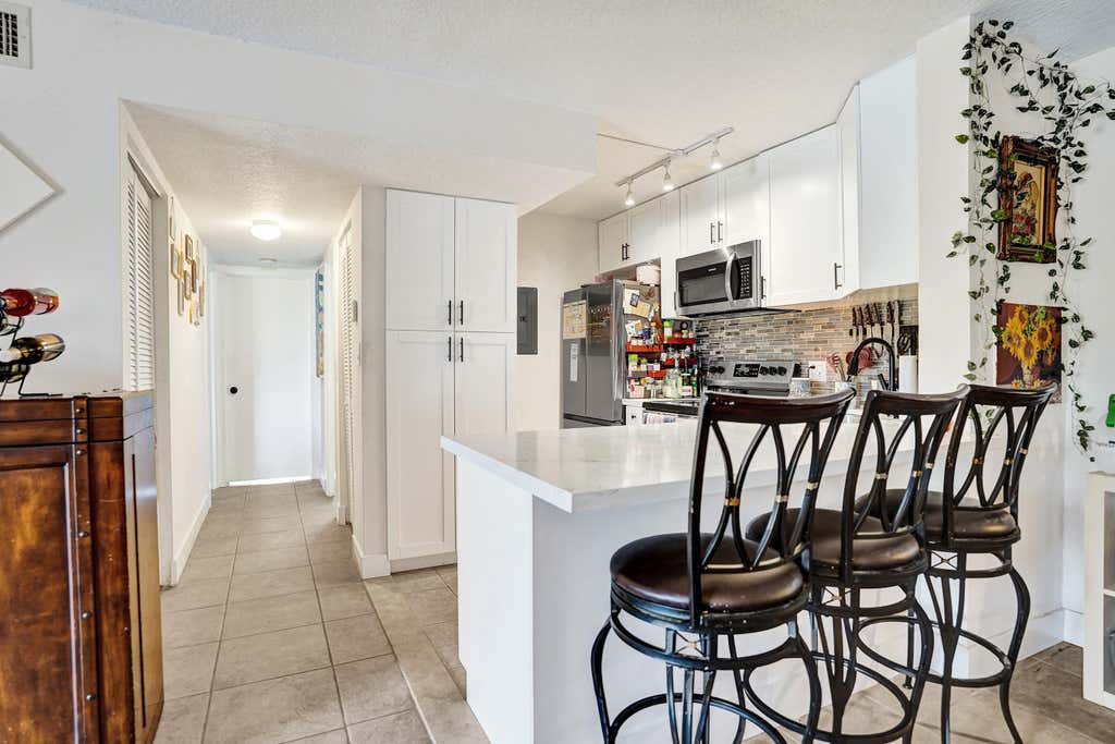 Photo of 629 Sea Pine Way #A1, Greenacres, FL 33415 (MLS # B26059113)