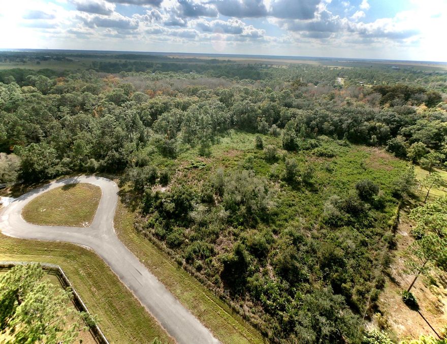 7.03 Acres - End of Cul-de-Sac!Beautiful vacant land in the Pinelands with a majestic natural border and semi-cleared front section--perfect for placing your new home. The back and one side are heavy, mature woods, creating a private, picturesque backyard setting. Located in north Okeechobee County, offering an easy commute to Vero Beach and Fort Pierce.39603 NW 19th Ave.