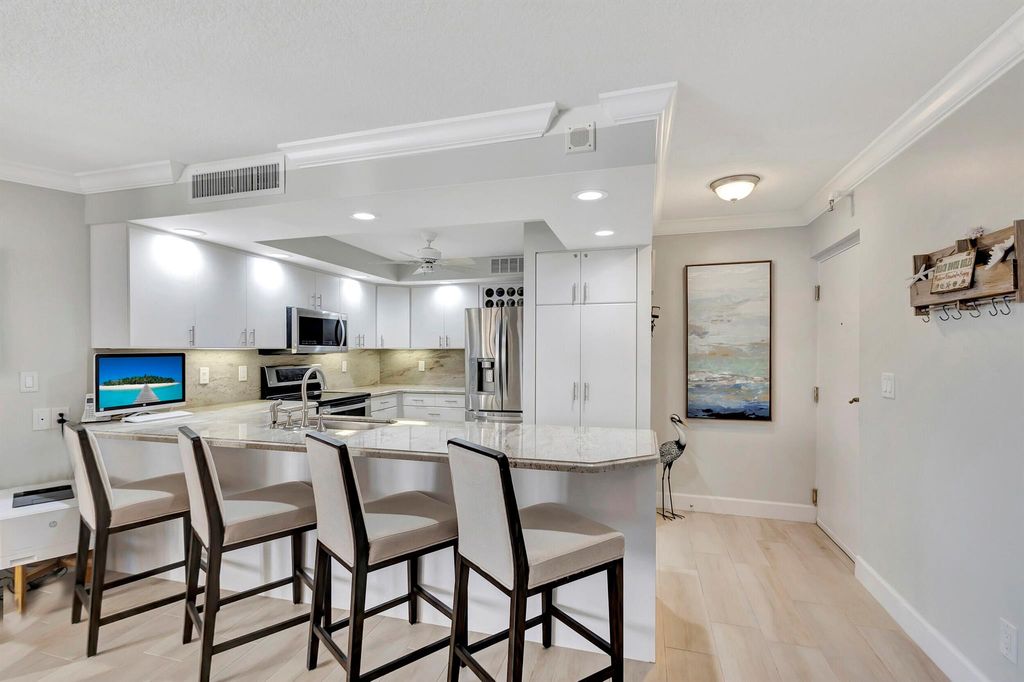 Photo of 2800 N Ocean Drive #A 23 C, Singer Island, FL 33404 (MLS # R10964415)
