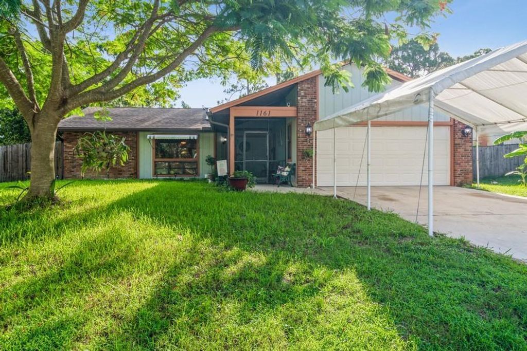 Photo of 1161 SE Odonnell Lane, Port Saint Lucie, FL 34983 (MLS # R10730225)
