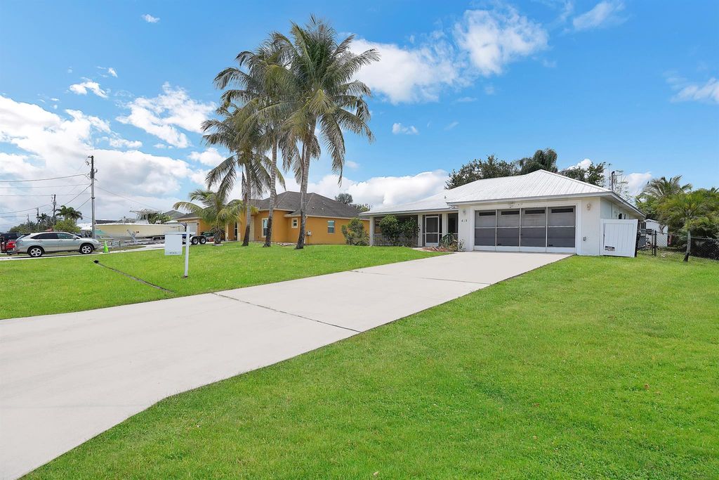 Photo of 419 SW Kestor Drive, Port Saint Lucie, FL 34953 (MLS # R10982721)