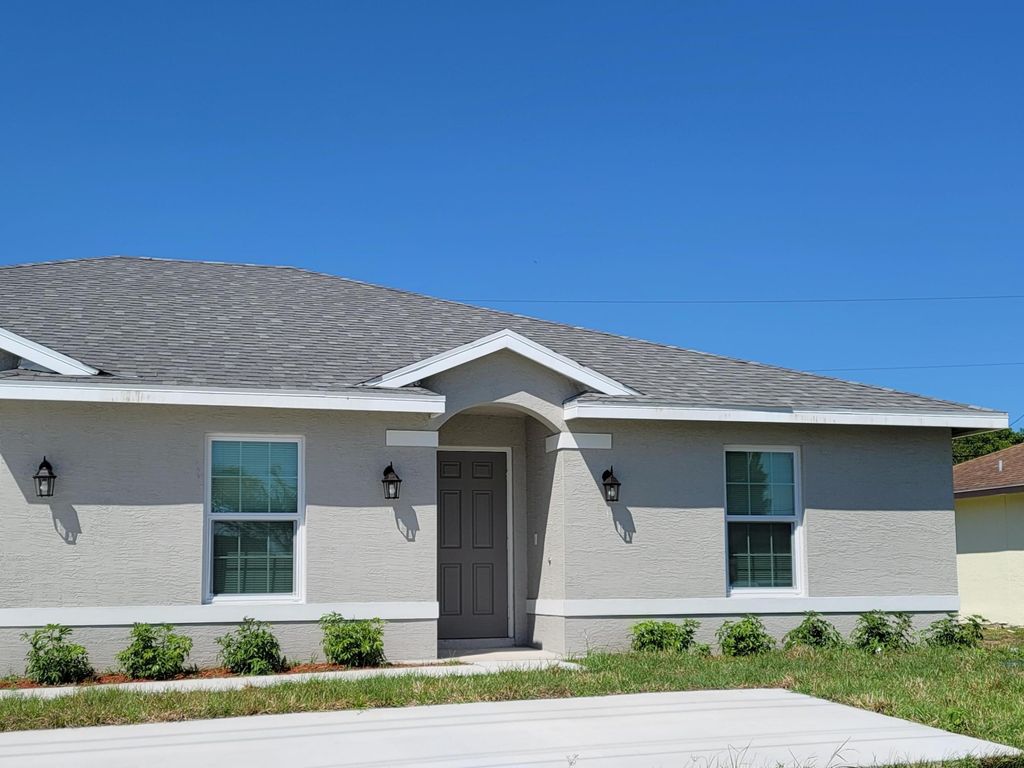 Photo of 459 SW Paar Drive, Port Saint Lucie, FL 34953 (MLS # B26004793)