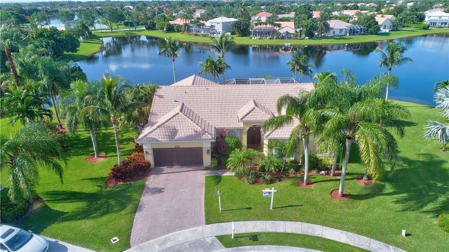 Largest & best lot in Boca Vista w/amazing water views on a quiet cul-de-sac. This 4/2 point-lot home features a brand new kitchen, all new laminate floors in 3 bedrooms, new vanity in master bath, 2012 A/C & water heater, accordion shutters (except for 3 windows), sprinklers fed from lake, laundry room & updated bathrooms. The master bedroom has real wood floors, crown molding & large walk in closet. Gorgeous lake views from every room. Close to shopping, dining, schools and highways. This a MUST SEE!