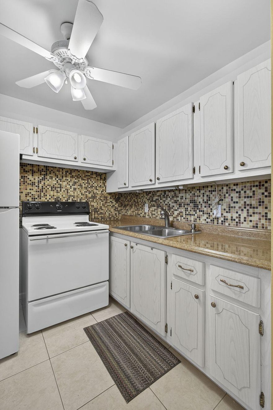 TURNKEY! MOVE INTO THIS LIGHT & BRIGHT 2ND FLOOR 1 BED 1.5 BATH UNIT.BEAUTIFULLY UPDATED BATHROOMS  NEW KITCHEN APPLIANCES NEWER HOT WATER HEATER STYLISH FURNITURE. CERAMIC TILE THROUGHOUT  WELL MANAGED ASSOCIATION. SIT OUT AND RELAX ON THE ASSOCIATION'S PATIO. STEPS TO THE CAMDEN POOL.  COME & ENJOY RESORT STYLE LIVING IN THIS GATED COMMUNITY FOR ADULTS 55 +CLUBHOUSE features a theater, indoor pool, card room, community/party room, billiard room ,shuffle board ,tennis , pickleball ,bocce and two outdoor pools. Numerous heated outdoor pools throughout the community. Separate fitness center with gym , outdoor heated pool and a resistance pool. Two guarded gates and 24 hour roving security patrol. GREAT LOCATION: close to shops, restaurants, PBI airport and beaches.