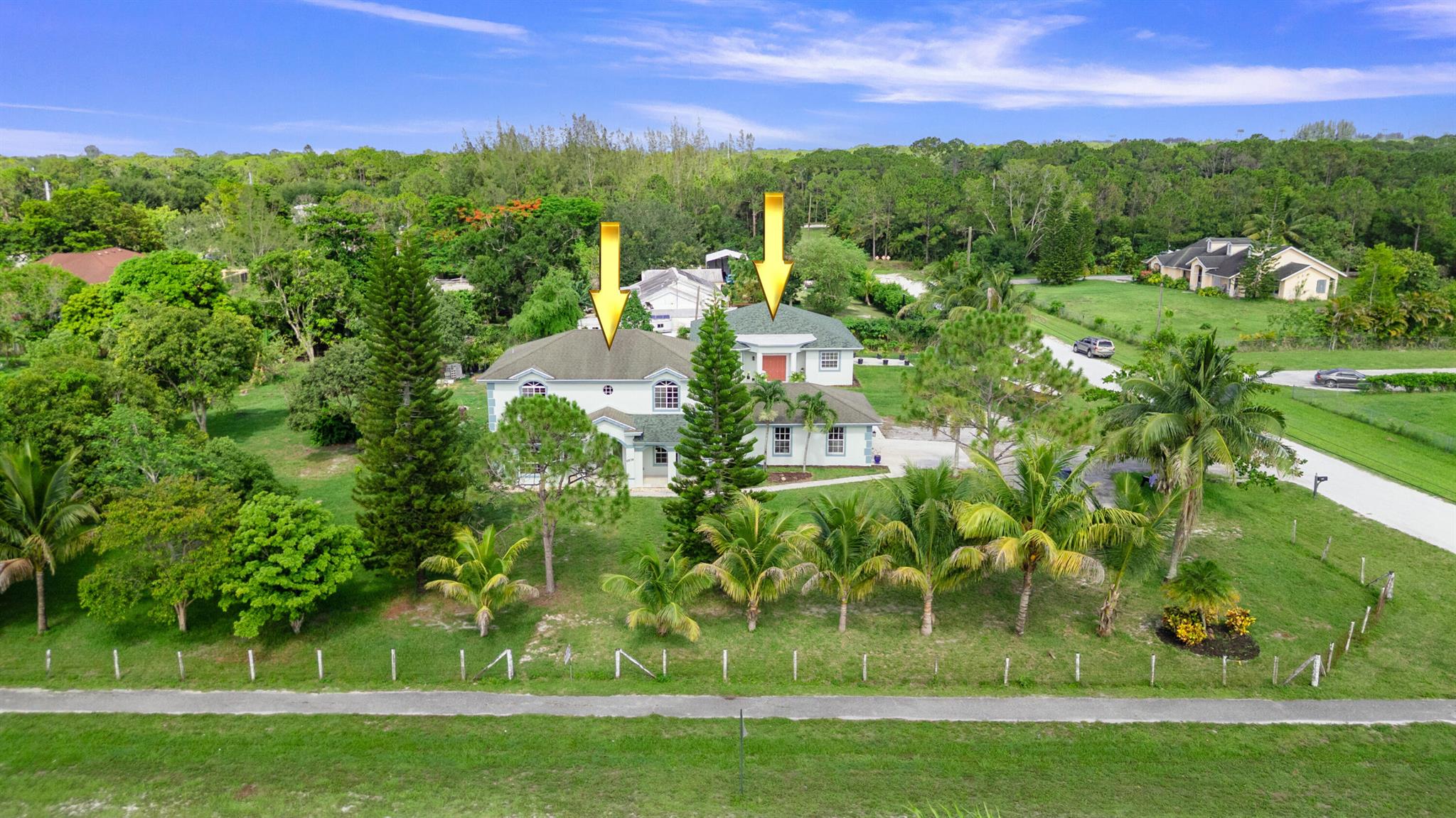 Two Homes on 1.34 Acres - Multi-Generational or Income Opportunity!Discover this rare gem featuring two separate homes on a sprawling 1.34-acre lot, offering a total of 6 bedrooms, 5.5 bathrooms, and nearly 4,500 sq ft under air. Perfect for multi-generational living or as an income-producing investment, this property provides space, privacy, and flexibility.The main house boasts 4 bedrooms and 3 full bathrooms, including a downstairs bedroom and a full bath. Enjoy the charm of a vaulted foyer entry with ceramic tile, leading to a formal dining room, media room with wood floors, and a bright Florida room with updated wood flooring. The remodeled kitchen features energy-efficient appliances, a breakfast nook, and modern finishes. A computer/flex room, bay windows, and almost all