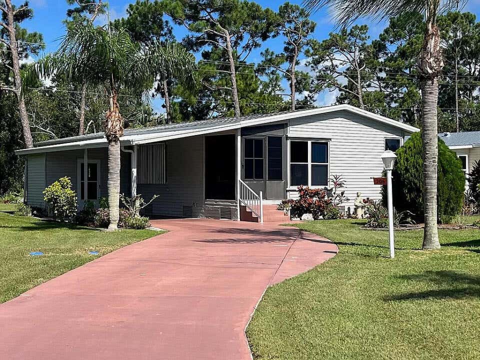 Photo of 206 Travis Cay Place #8, Fort Pierce, FL 34982 (MLS # R10932186)