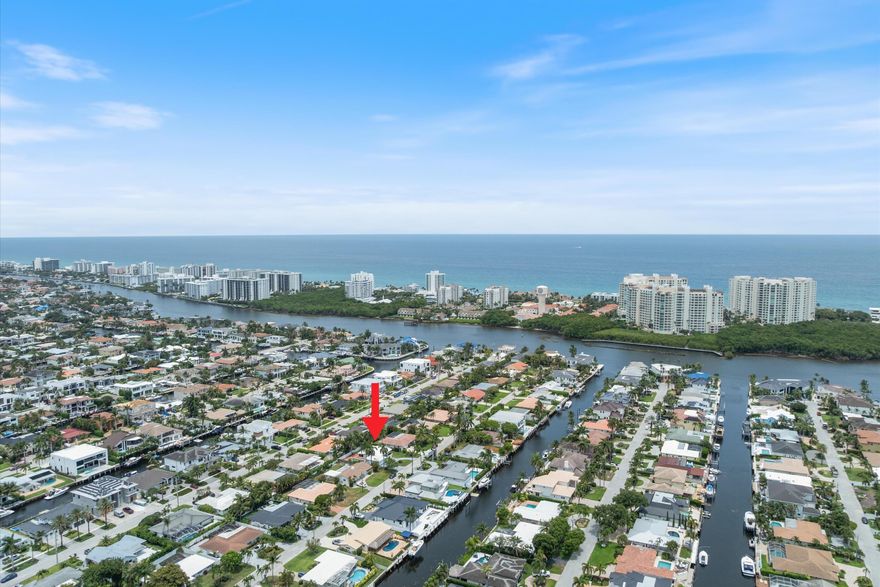 Charming East Boca Raton home in a non-HOA intracoastal community of Bel Marra! This sweet home is full of character and offers lots of enjoyment without feeling overwhelmed with upkeep. Less maintenance means more time at the beach, which is just a few minutes away. Inside you will appreciate the open concept with crown moldings in the living and dining area. Large hurricane windows fill the rooms with natural light. The fenced back yard features a nice screened patio, a spacious open patio and a larger than expected pool. The double car garage and decorative circular drive allows for 4-5 cars. This home has an awesome location and is surrounded by multi-million dollar homes. Located only minutes to Downtown Boca & Delray. This is a rare opportunity. Priced below appraised value! Come See Additional features of this home includes a nicely sized laundry/mud room just off the kitchen with access to back yard. The kitchen is spacious with a generous amount of beautiful quartz countertops, deep drawers and ample cabinets. The kitchen peninsula is great for additional seating, serving and entertaining guests. The dining area has large windows overlooking the tropical back yard and makes for a beautiful setting while enjoying dinner. The primary bedroom is separated across the house from the other bedrooms and features a walk-in closet and ensuite bath. The living room is custom wired for a 5.1.2 home theater for your surround sound pleasures. The living room also features large hurricane windows which are also tinted to help with energy efficiency and privacy. Speaking of energy efficiency, additional insulation has been added in the attic along with updated ceiling fans throughout the home. This home lives large with the oversized swimming pool and patio/bbq area. Enjoy the tropical sea breezes while sitting on your screened lanai. This is a solid CBS house and they really don't make them like this any more. Bel Marra is an intracoastal NON HOA community and its location between Downtown Delray and Boca makes for easy access to either for a nice night on the town or an afternoon at Mizner Park, the Boca Art Museum, or dinner on Atlantic Ave. The beaches are 5 minutes by car and Boca has many beautiful public parks for all to enjoy. This property would make for a great starter home, 2nd home or potential future investment due to the lot and location. This home is being offered below recent appraisal value and is move-in ready! Don't wait!