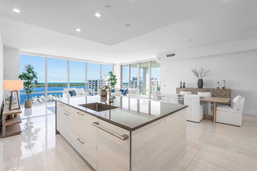 Exquisite fully furnished and styled 3 Bedrooms + Den, 3 1/2 bath condo (all bedrooms are en-suite). Contemporary condo offers a massive balcony with sunrise and sunset views and direct unobstructed panoramic Intracoastal and Ocean views. The expansive intracoastal balcony graciously accommodates full outdoor dining. The floor-to-ceiling windows offer astonishing waterfront views from any location. This luxury condo comes with many upgrades including: porcelain tile & wood porcelain plank in bedrooms, wine cooler extension, living area/tv matching custom cabinetry, designer tile in the kitchen and powder room, high end lighting, remote control auto blinds and fans, & crown molding. Water Club offers a luxurious lifestyle with generous resort-style amenities on over 8 acres of lushly