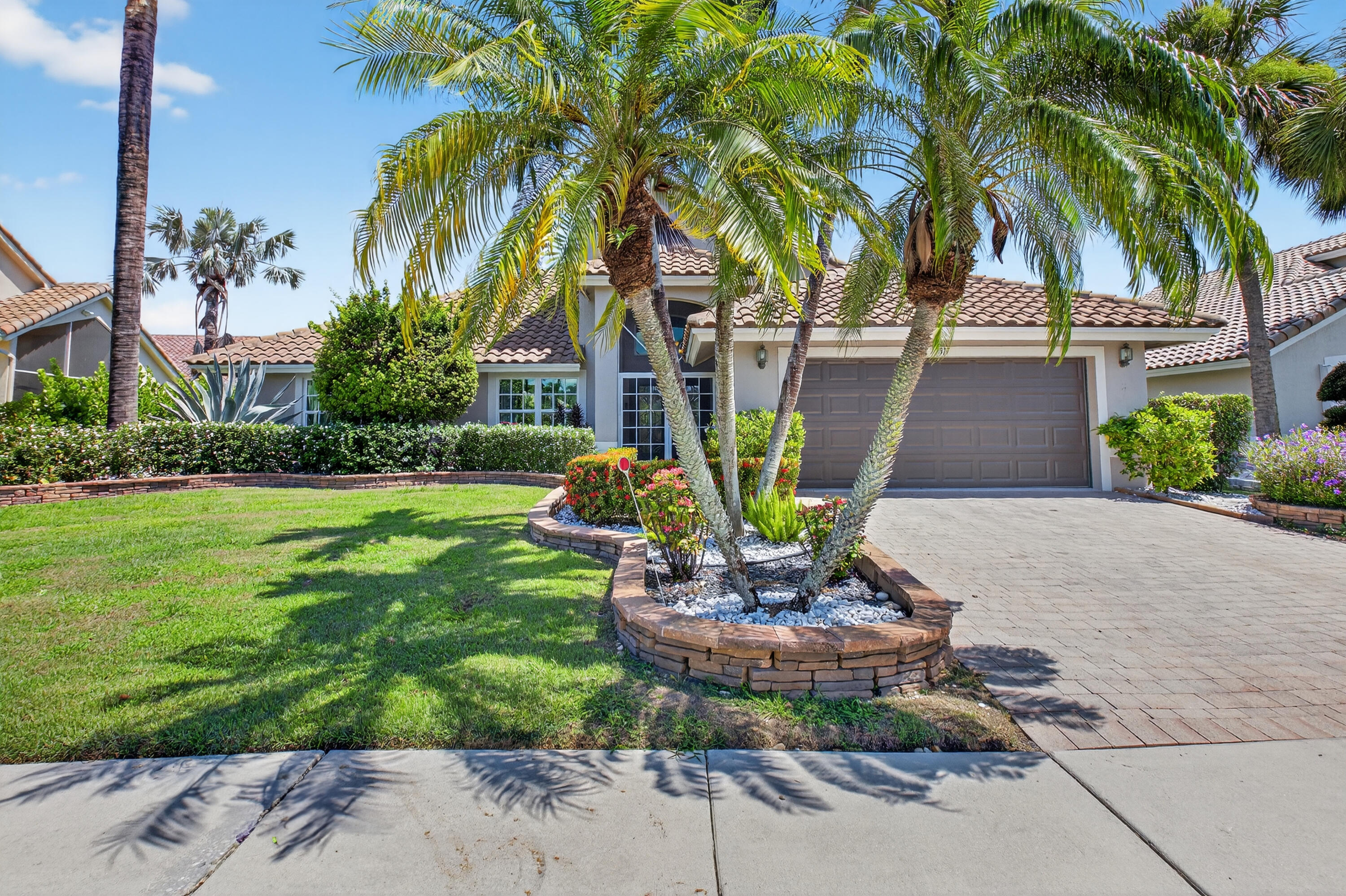 NO MANDATORY GOLF MEMBERSHIP REQUIRED - NEW ROOF INSTALLED IN 2020 - BRENTWOOD 11 FLOOR PLAN - COVERED PORCH (15'4'' X 11'0'') HAS BEEN CONVERTED INTO AN INDOOR AIR CONDITIONED SPACE TO BE USED AS A SUNROOM/MEDIA/ ENTERTAINMENT ROOM - THIS WELL MAINTAINED HOME HAS 2 BEDROOMS & AN OFFICE/DEN THAT CAN BE CONVERTED BACK INTO A 3RD BEDROOM - BEAUTIFUL OFFICE WITH A BUILT-IN DESK & WOOD CUSTOM CABINETRY - AC 5 TON - 7 - 8 YEARS OLD - HAS BEEN SERVICED 2X A YEAR - SOLAR PANELS AND BACK-UP BATTERY - IMPACT GLASS WINDOWS - HURRICANE FRONT DOOR AND GARAGE DOOR - WATER INFILTRATION SYSTEM - LG APPLIANCES - ECHO SMART INSTANTANEOUS WATER HEATER - PRIVATE BACK PATIO HAS ITALIAN STONE & MARBLE - GARAGE FLOOR REDONE - GRANITE COUNTERTOPS - PATIO FURNITURE INCLUDED - OVERALL IMPROVEMENTS COST $130,000.