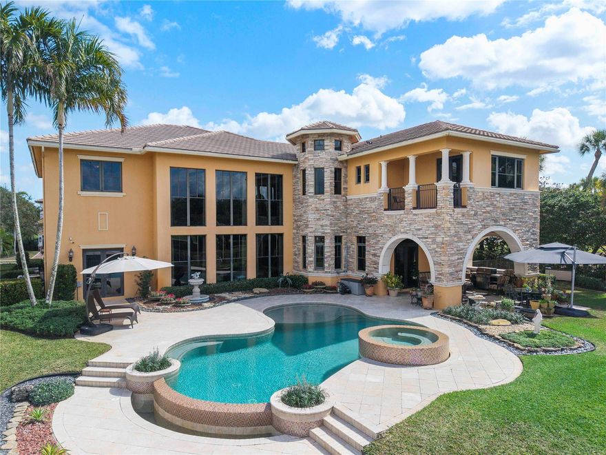 CUSTOM WATERFRONT GOLF ESTATE! This oversized Almeria Model with Over $700,000 in upgrades on a premium oversized corner waterfront & golf lot overlooking the 2nd green on one of PGCC’s most sought-after interior streets! With close to 6000 interior square feet, this 6 bedroom - 7 bath masterpiece has one of the most popular layouts in all of Parkland Golf. Featuring an ENORMOUS master suite with master lounge, breathtaking bathroom and grand balcony facing golf course and lake, this home screams luxury living. Each upstairs bedroom features on-suite living with interior full baths in each room with a phenomenal upstairs living area overlooking the grand first floor. Soaring ceilings, vast kitchen with large butlers pantry and amazing outdoor space make this a truly amazing home!