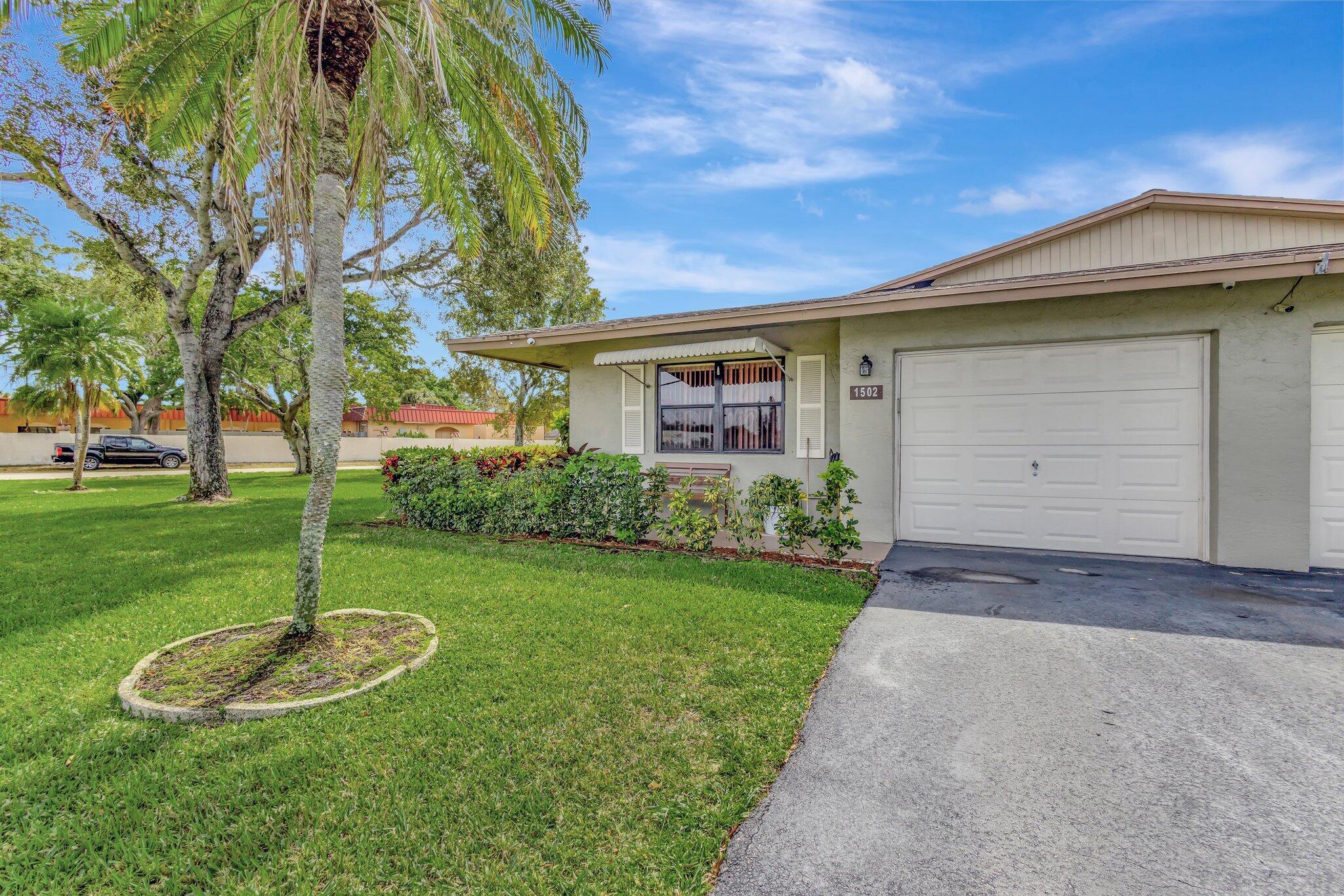 Spic and span and READY! 2BR 2BA villa w/ 1 car oversized gar. Prime location, private corner, just 2 lots from pool. Enjoy greenbelt view and privacy on glassed-in A/C Florida Rm, room, Split bedrooms, open and airy layout, with plenty of natural light. The kitchen has been updated with pantry +Rm for Table. Master bath just been updated and remodeled see-PICTURES. Windows w/Accordion Hurricane Shutters for windstorm protection. New 24 inch Tile floors thru-out. New A/C, Hot Water Heater, Newer ROOF, and NEW ELECTRICAL PANEL just updated. Interior Washer/Dryer Rm. The backyard features an extended open patio, ideal for relaxation & enjoy the privacy of a yard with no neighbors behind you. The community pool within walking distance. Pet restriction, one pet (up to 20 lbs.)
