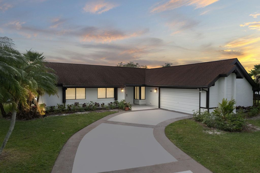 Photo of 1991 SE Erwin Road, Port Saint Lucie, FL 34952 (MLS # R11015598)
