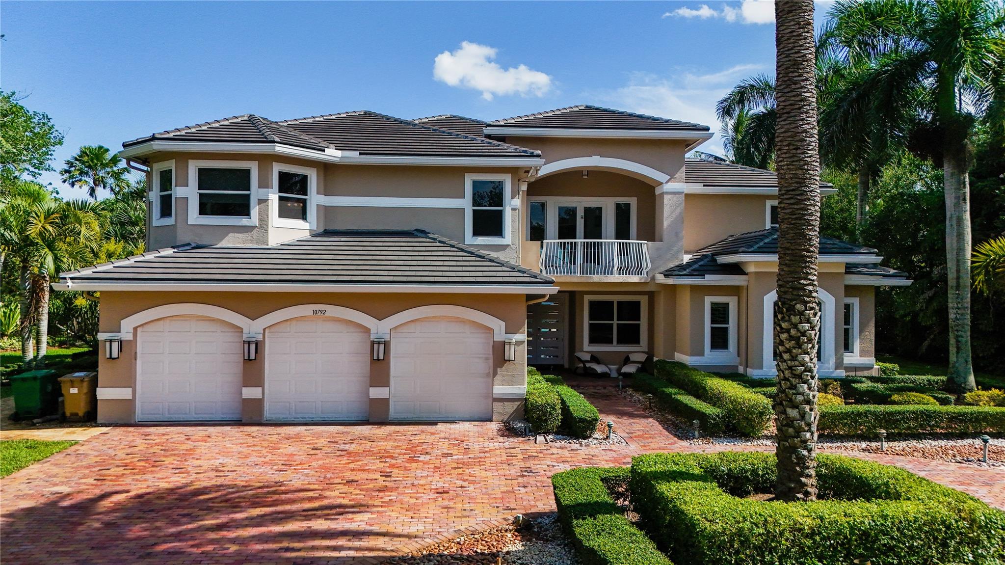 THE MOST SPECTACULAR ESTATE IN LONG LAKE RANCHES! Welcome to this masterfully reimagined Renoir Majestic model that offers 5,780 sq ft of luxury living. This 6-bedroom, 7-bath estate was upgraded with modern contemporary flair and impeccable design finishes throughout. Enjoy a stunning chef’s kitchen featuring a gas range, custom cabinetry, center island, and top-of-the-line appliances. Retreat to a lavish primary suite with sitting area, spa-style bath, and custom walk-ins. Flooring includes marble, wood, and a new carpet. Step outside into a true tropical oasis: a resort-style pool and spa and serene lakefront views, all surrounded by lush landscaping and a fenced yard. This estate includes full impact glass, newer A/C & Roof. The house is in a prestigious guard-gated community.