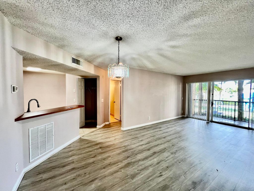 Photo of 8781 Wiles Road #203, Pompano Beach, FL 33067 (MLS # R11165118)