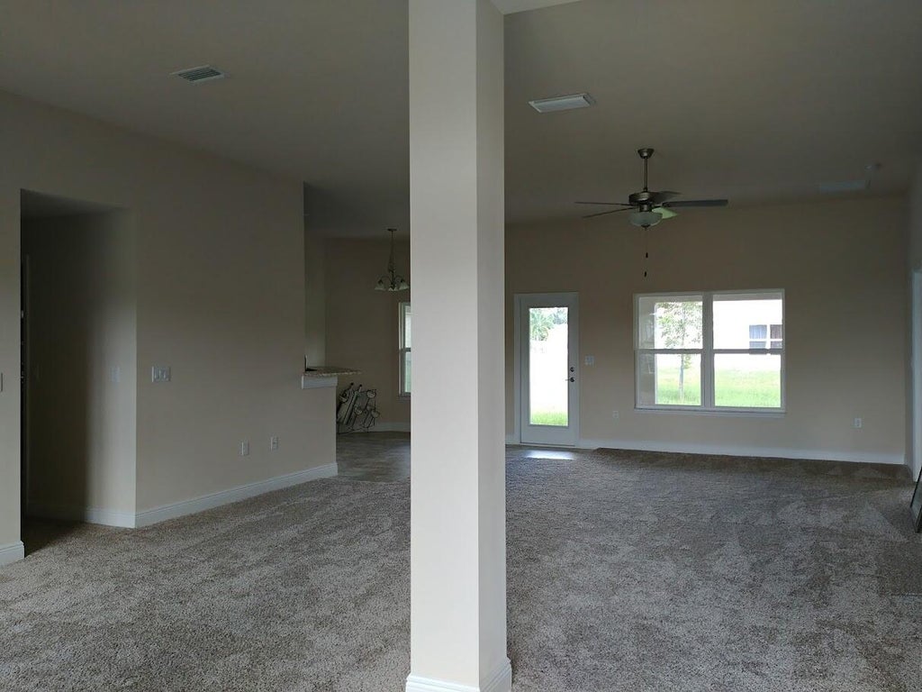Photo of 1037 SW Hamrock Avenue, Port Saint Lucie, FL 34953 (MLS # R11011295)