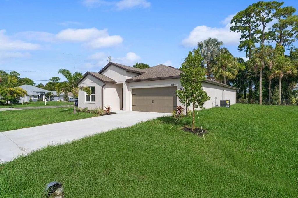 Photo of 1689 SW Abingdon Avenue, Port Saint Lucie, FL 34953 (MLS # R11158837)
