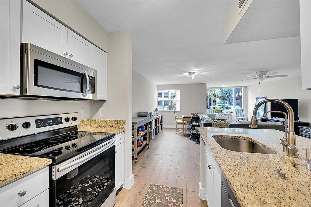 Photo of 2841 N Oakland Forest Dr #106, Oakland Park, FL 33309 (MLS # F10532182)