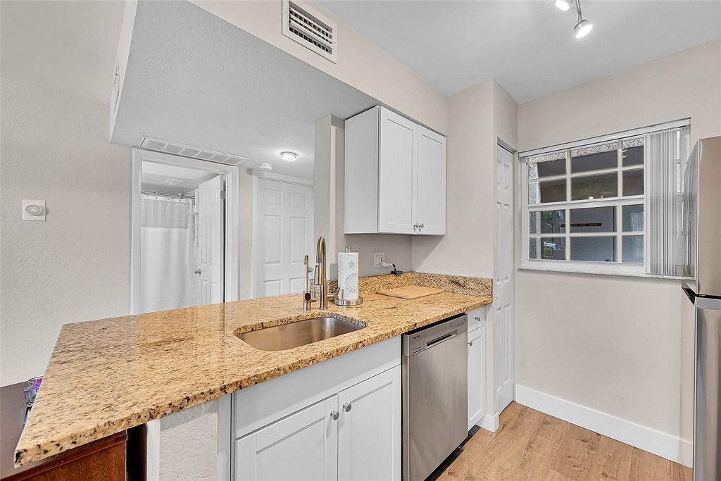 Photo of 2841 N Oakland Forest Dr #106, Oakland Park, FL 33309 (MLS # F10532182)
