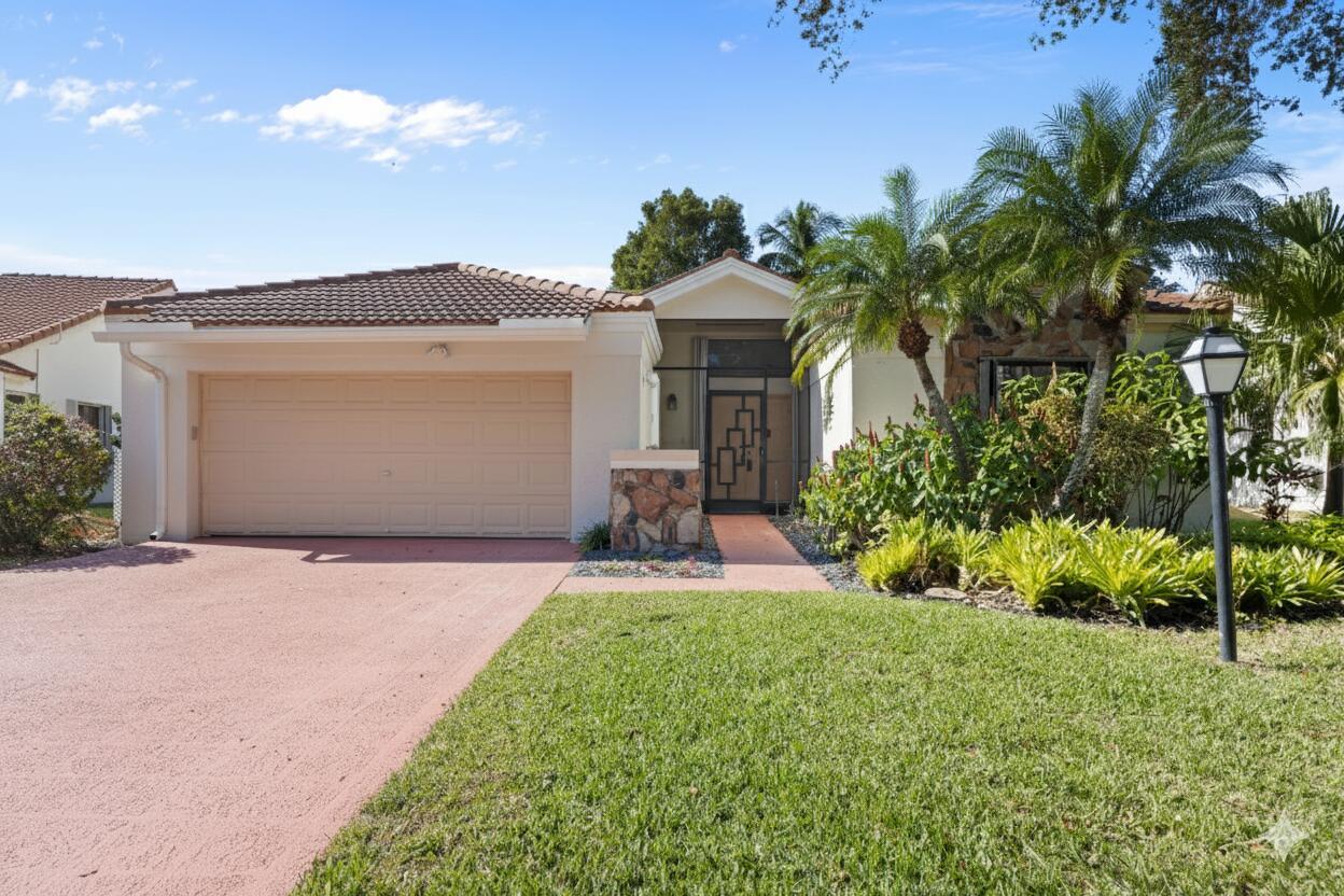 South Florida Lakefront paradise! This SFH offers 3 bd, 2 baths, 2 CG w/approx 2100 sqft under air. Foyer offers double door entry leading into LR w/vaulted ceiling & tile flooring, from the LR leads into the kitchen w/, SS appliances, raised panel cabinetry, solid surface countertops & pantry w/ample storage! NEW LVP flooring in Kitchen, Dining & Family Room. Kitchen is open to dining room w/built-in buffet perfect for hosting. Family room w/ 2 sliders out to a covered screened-in patio overlooking the tranquil water views. Primary Suite offers newer carpeting & views of the lake, w/HUGE walk-in closet & ensuite w/roman tub, step in shower & dual sinks PLUS skylight for natural light. Front private guest bedroom w/newer carpeting, guest bath w/recently resurfaced tub, see more