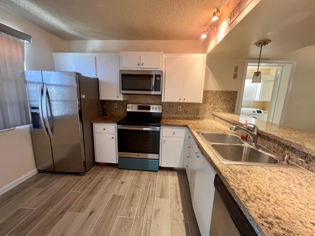 Photo of 3515 Village Boulevard #402, West Palm Beach, FL 33409 (MLS # R11054652)