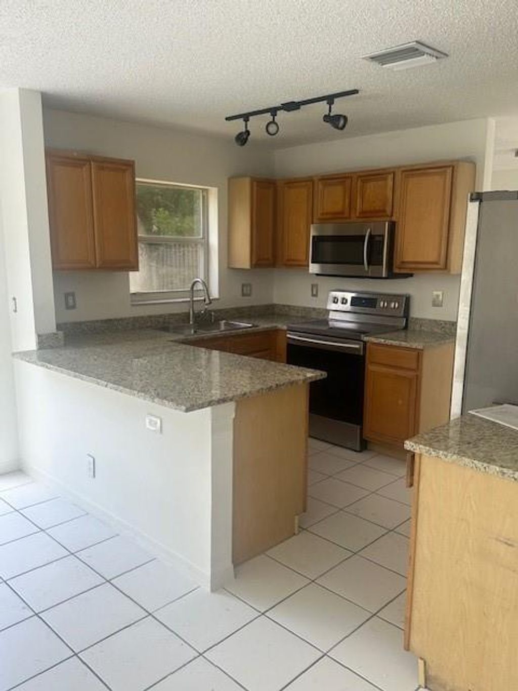 Photo of 79 NW 44th Terrace, Deerfield Beach, FL 33442 (MLS # F10460022)