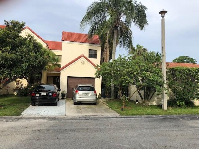 Desirable Boca Raton townhome for rent a rare find, 3 Bedroom 3-Bathrooms situated in A+ rated school district. Welcome to your dream rental with high volume ceilings and tile floor downstairs and laminate flooring upstairs, features a one-car garage and a double parking driveway, making it perfect for renters with multiple cars.Spacious Primary Suite: Enjoy the convenience of having the primary bedroom conveniently located on the ground floor, complete with an ensuite bathroom for ultimate privacy and comfort.More