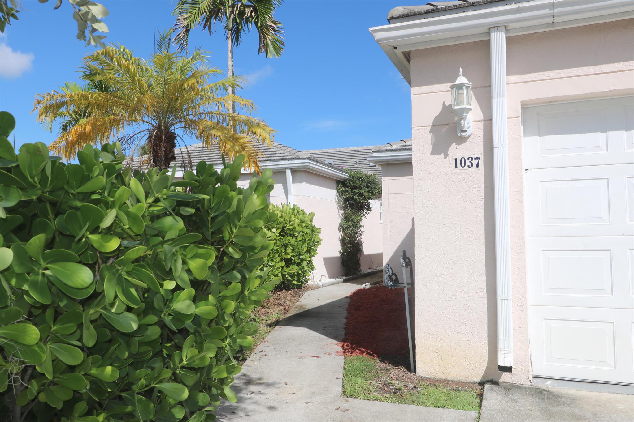 Welcome to this beautifully maintained townhome offering comfort, convenience, and plenty of space for the whole family. Featuring 3 bedrooms, 2 bathrooms, a 2-car garage and a convenient driveway, this home is located in a gated community for added privacy and peace of mind. Situated in the heart of Greenacres, just minutes from supermarkets, restaurants, parks, shopping malls, and with easy access to Florida's Turnpike. Don't miss the opportunity to live in a vibrant community with everything you need close by!