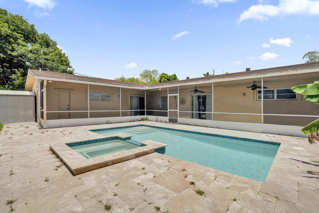 Photo of 811 NW 43rd Avenue, Coconut Creek, FL 33066 (MLS # B26042029)
