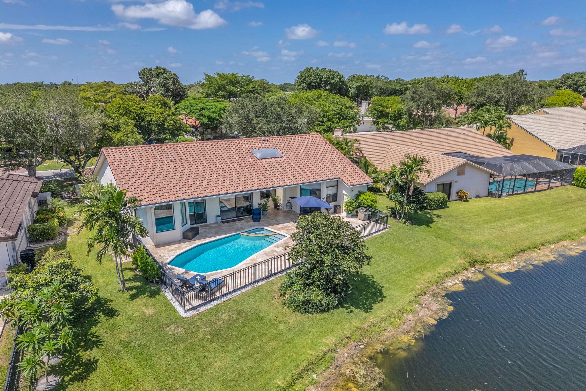 This stunning property offers the perfect blend of luxury and lifestyle. Enjoy serene canal views from your private pool deck, finished with elegant travertine. Inside, high ceilings enhance the open feel, with stylish ceramic tile and vinyl flooring throughout. The sleek white quartz kitchen is equipped with stainless steel appliances, perfect for cooking and entertaining. Located in a resort-style community featuring a golf course country club, clubhouse, pickleball courts, fitness center, and more premium amenities with no membership fee required, this home truly has it all. Easy access to Sawgrass Expressway, Plenty of dining, shopping and entertainment!