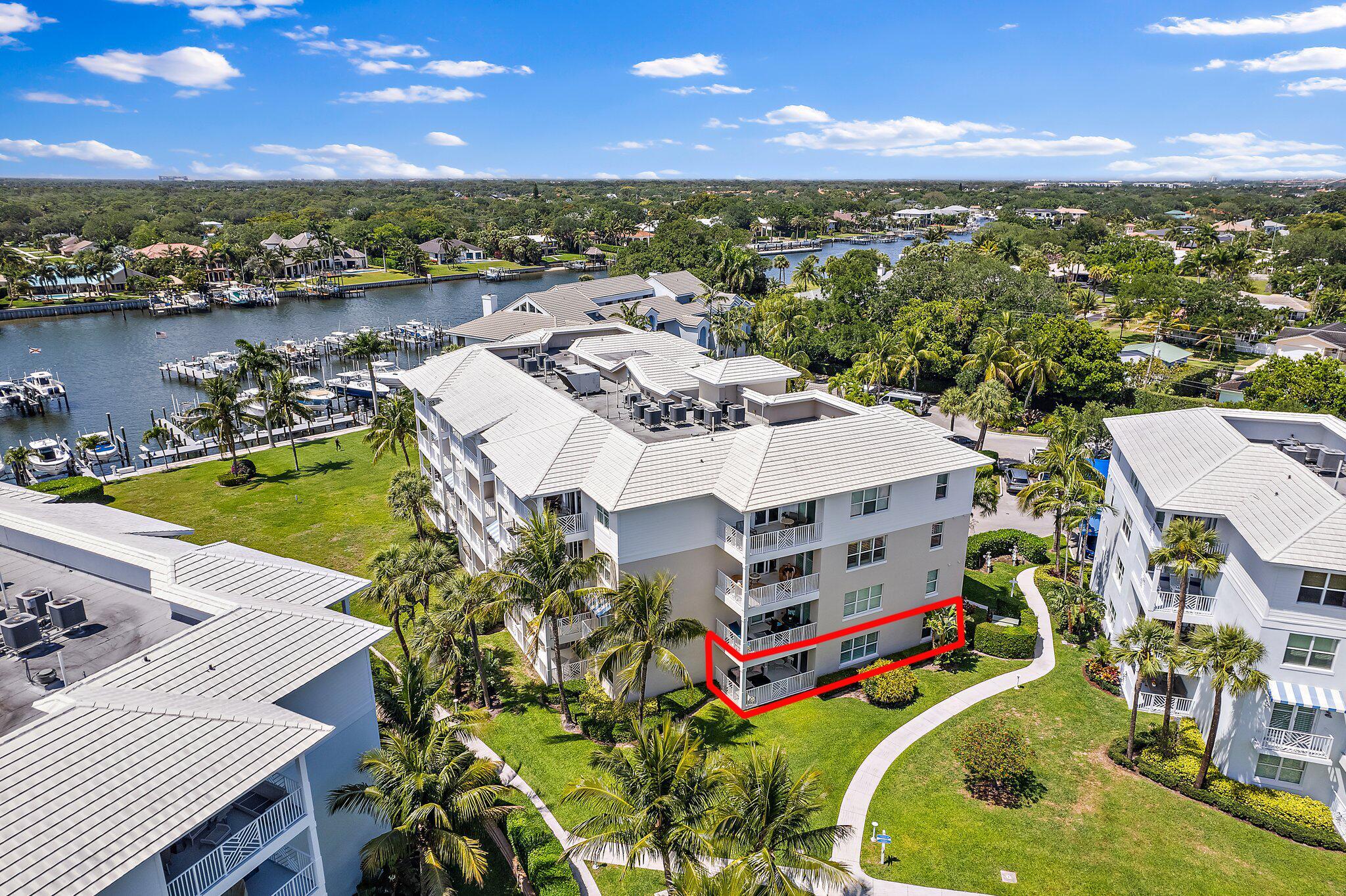 Bring your pets and your boat! Move right into this beautifully renovated first-floor condo in the desirable Bay Colony community of Juno Beach. Built in 2014, this spacious unit features hurricane impact glass, 9-foot ceilings, and an open-concept great room that flows seamlessly onto a peaceful patio. A gate from the patio allows for easy access to the common area lawn--perfect for pet owners! Unit 411 also includes a 40-ft boat slip, 9,000 lb lift, covered parking space located close to the building entrance and an interior storage unit. Enjoy the resort-style pool, fitness center, tennis/pickleball courts, BBQ grills, and a community firepit. Two pets allowed per residence. Condo available for purchase without boat slip as well.