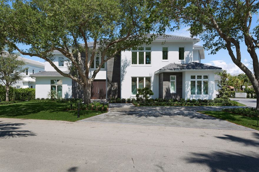Looking west over a lake on the golf course, this stylish estate was just completed in 2017, using fine finishes and luxury features.  Stepping stones beckon to the sleek Pebble-Tec pool and spa on the immaculate easy-care grounds with a cooling mist system.  Anchored by a stacked stone linear fireplace, the outdoor living room serves alfresco dining from the summer kitchen and grilling station.  On the corner property, tropical trees frame the sweeping drive that circles around to the side-entry three-bay garage with additional golf cart storage.Buyer pays title insurance, Florida documentary stamps, and all other closing costs. (for new construction and land use) Taxes on land only.Royal Palm Yacht and Country Club membership is separate and not affiliated with RPIA homeownership